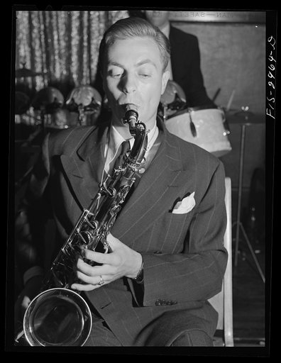 Jesse Younger playing the saxophone in small band for a Saturday night dance. He has defrayed part of his college expenses this way for four years. Lincoln, Nebraska
