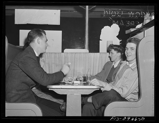 Untitled photo, possibly related to: John Cockle and his girlfriend in the University drugstore. Lincoln, Nebraska