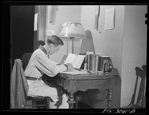 Jim Tillma wears overalls while studying. University of Nebraska, Lincoln