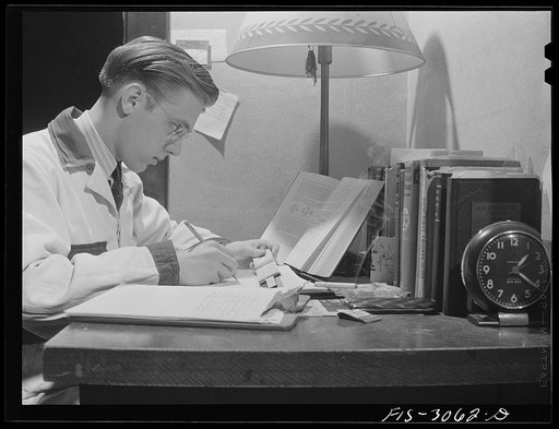 Jim Tillma wears overalls while studying. University of Nebraska, Lincoln