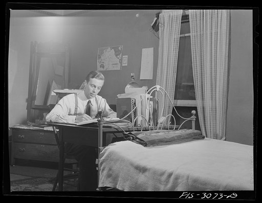 Jesse Younger, premedical student, studying in his rooming house. University of Nebraska, Lincoln