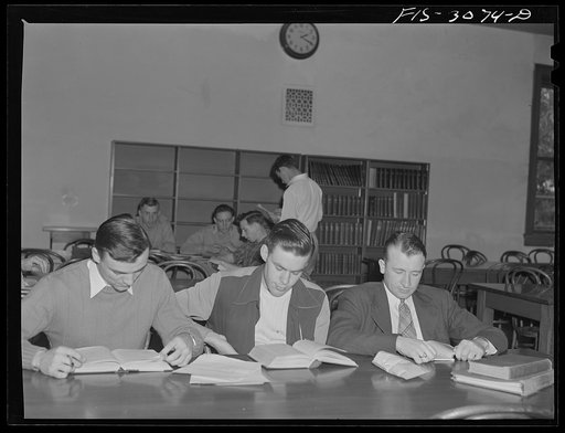 Untitled photo, possibly related to: Bob Aden (at the second table) studying in the library. University of Nebraska, Lincoln