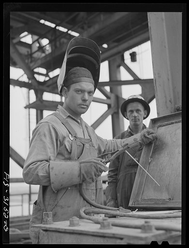 Untitled photo, possibly related to: Douglas Dam, Tennessee. Tennessee Valley Authority (TVA). Welder