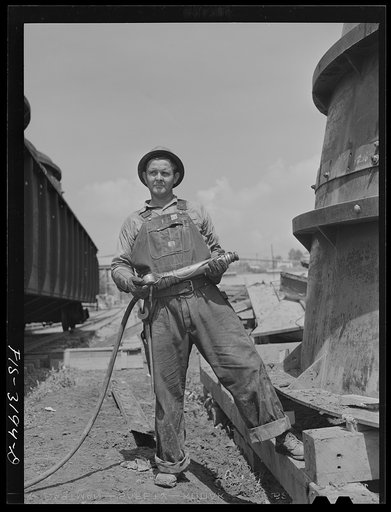 Untitled photo, possibly related to: Fort Loudon [i.e., Loudoun] Dam, Tennessee. Tennessee Valley Authority (TVA). Riveter