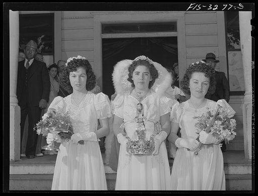 Dorothy Bettencourt, Queen of the Holy Ghost Festival of the Portuguese-Americans at Novato, California, and her maids leave the I.D.E.S.I. hall for the parade to church where special mass will be said