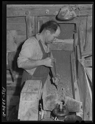 Kern County, California. Tungsten chief mine. Partly crushed tungsten ores moving into the secondary crushers