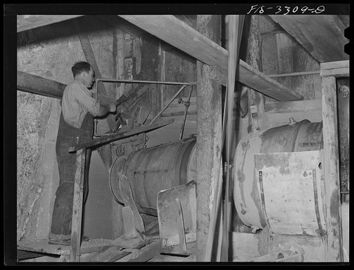 Kern County, California. Mill of the Tungsten Chief Mine. Ball mills which grind the tungsten ore into particles suitable for the tabling concentration
