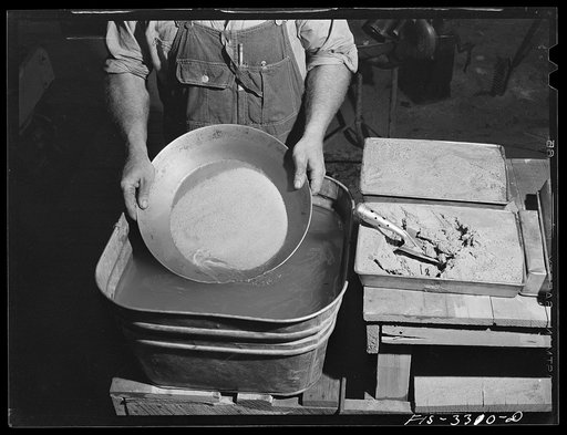 Kern County, California. Mill of the Tungsten Chief Mine. Panning partly concentrated tungsten ore