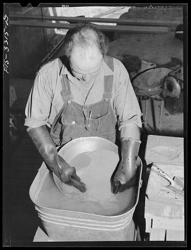 Kern County, California. Mill of the Tungsten Chief Mine. Panning partly concentrated tungsten ore