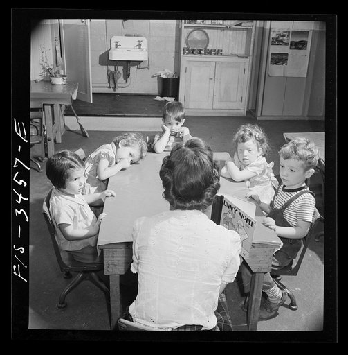 Greenbelt, Maryland. Federal housing project. Story hour in the nursey school which is run cooperatively by the mothers. The teacher is paid twenty-five dollars a week