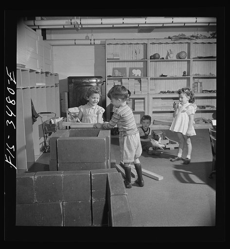 Untitled photo, possibly related to: Greenbelt, Maryland. Federal housing project. Building a railroad train out of blocks at the nursery school
