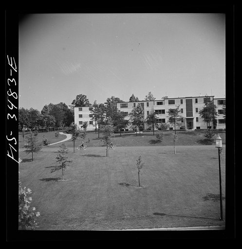 Untitled photo, possibly related to: Greenbelt, Maryland. Federal housing project. View from the shopping center roof showing apartment houses on the hill