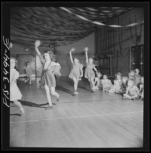 Greenbelt, Maryland. Federal housing project. Kindergarten children practicing a balloon dance in the gymnasium for their May Day festival