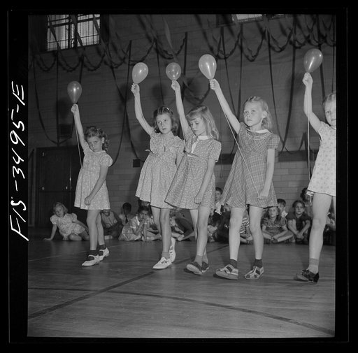 Untitled photo, possibly related to: Greenbelt, Maryland. Federal housing project. Kindergarten children practicing a balloon dance in the gymnasium for their May Day festival