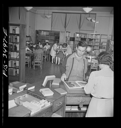Greenbelt, Maryland. Federal housing project. The school library is used as a community public library in the evening