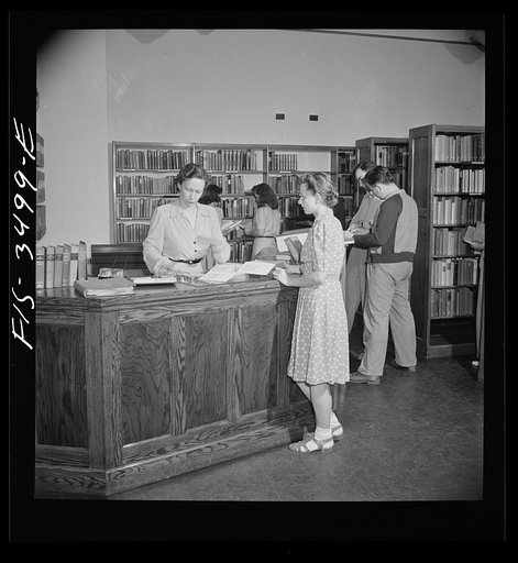 Greenbelt, Maryland. Federal housing project. The school library is used as a community library in the evening