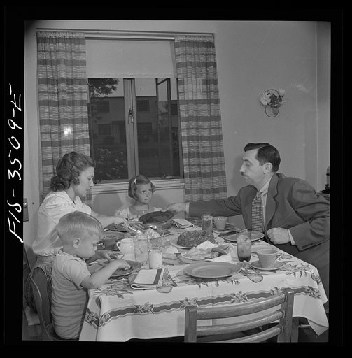 Untitled photo, possibly related to: Greenbelt, Maryland. Federal housing project. Mr. and Mrs. Leslie Atkins, Ann, and Pierce Atkins having supper