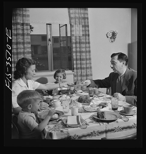Untitled photo, possibly related to: Greenbelt, Maryland. Federal housing project. Mr. and Mrs. Leslie Atkins, Ann, and Pierce Atkins having supper