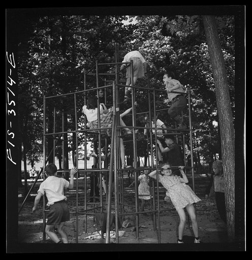 Untitled photo, possibly related to: Greenbelt, Maryland. Federal housing project. Children playing on apparatus in one of the numerous playgrounds situated in shady groves