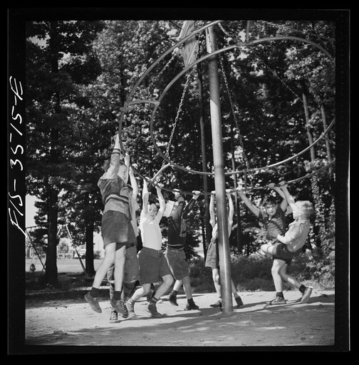 Untitled photo, possibly related to: Greenbelt, Maryland. Federal housing project. Children playing on apparatus in one of the numerous playgrounds situated in shady groves