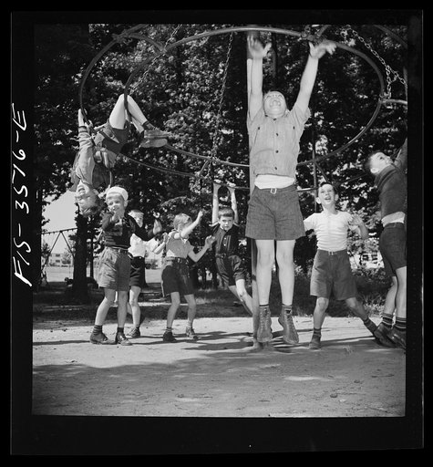Greenbelt, Maryland. Federal housing project. Children playing on apparatus in one of the numerous playgrounds situated in shady groves