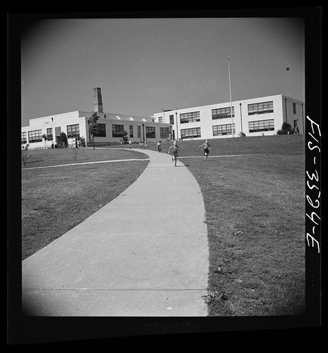 Untitled photo, possibly related to: Greenbelt, Maryland. Federal housing project. Children going home from school