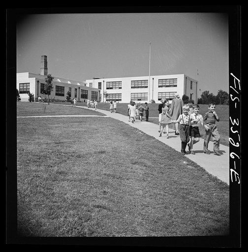 Untitled photo, possibly related to: Greenbelt, Maryland. Federal housing project. Children going home from school