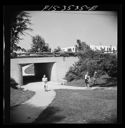 Greenbelt, Maryland. Federal housing project. Children returning home from school through an underpass