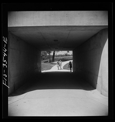 Greenbelt, Maryland. Federal housing project. Children returning from school through an underpass