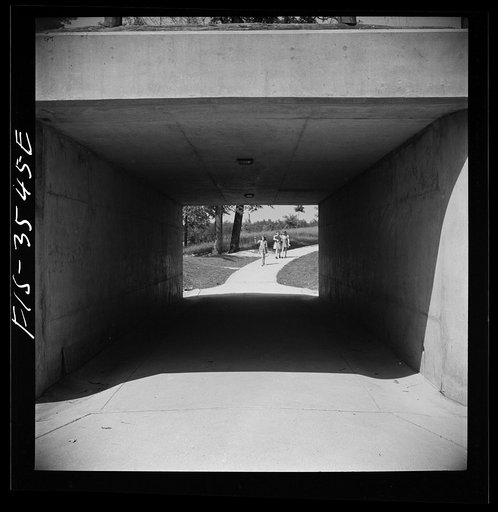 Untitled photo, possibly related to: Greenbelt, Maryland. Federal housing project. Children returning from school through an underpass