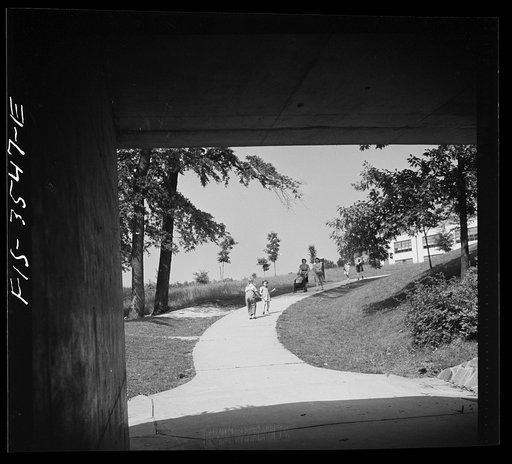 Untitled photo, possibly related to: Greenbelt, Maryland. Federal housing project. Underpass with the school in the background
