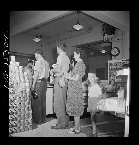 Greenbelt, Maryland. Federal housing project. Waiting to pay for purchases at checking gate in the cooperative grocery store