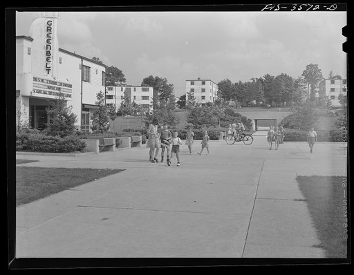 Greenbelt, Maryland. View from the shopping center, showing underpass, apartment houses and movie house