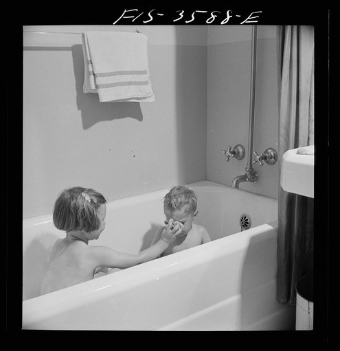 Untitled photo, possibly related to: Greenbelt, Maryland. Ann and Pierce (three years old) Atkins taking a bath together