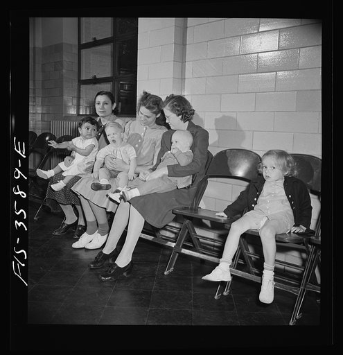 Greenbelt, Maryland. Mothers waiting with their children to get a physical examination by local doctors, offered free once a year to all Greenbelt children. These are new arrivals in the newly-built defense houses