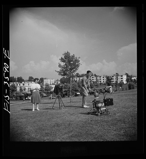 Untitled photo, possibly related to: Greenbelt, Maryland. Parents taking baby's picture on Sunday