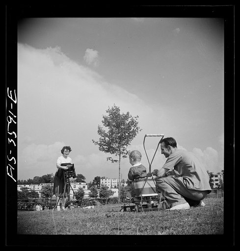 Greenbelt, Maryland. Parents taking baby's picture on Sunday