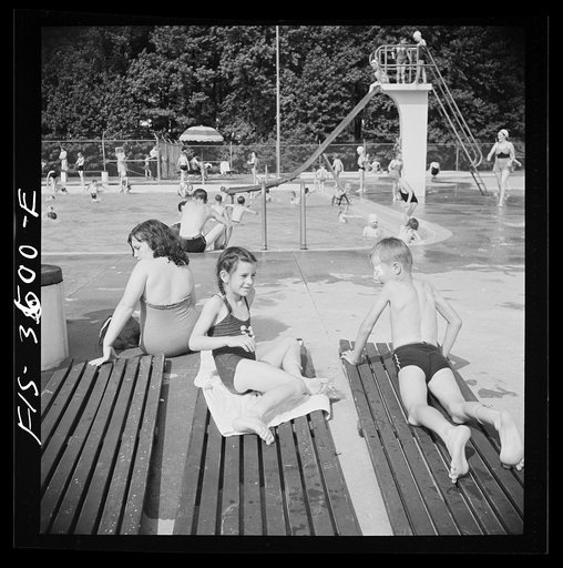 Greenbelt, Maryland. Sun bathers at the swimming pool