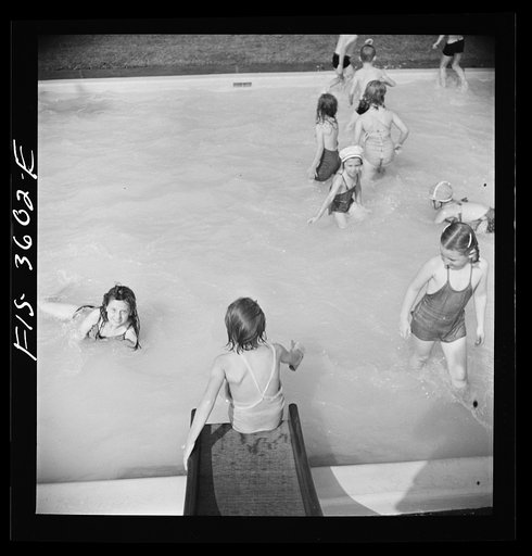 Untitled photo, possibly related to: Greenbelt, Maryland. A constant stream of water runs down the swimming pool slide