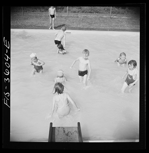Untitled photo, possibly related to: Greenbelt, Maryland. A constant stream of water runs down the swimming pool slide