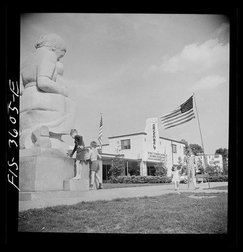 Greenbelt, Maryland. Children drinking at a water fountain in the shopping center on Memorial Day