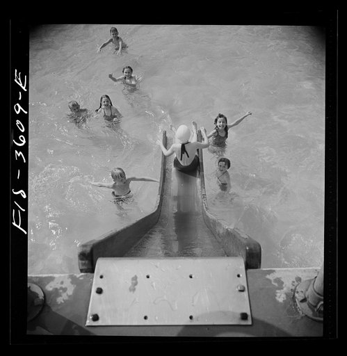 Greenbelt, Maryland. A constant stream of water runs down the swimming pool slide