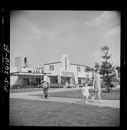 Untitled photo, possibly related to: Greenbelt, Maryland. View from the shopping center, showing underpass, apartment houses and movie house