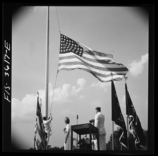 Greenbelt, Maryland. Lowering the flag at Memorial Day ceremonies conducted by the American Legion