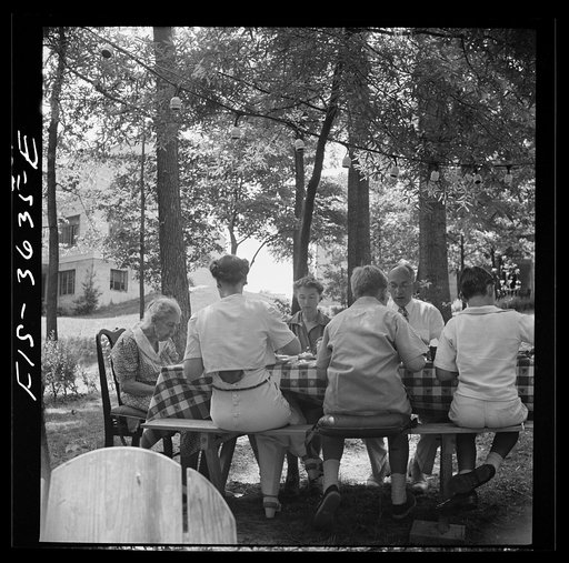 Untitled photo, possibly related to: Greenbelt, Maryland. Party for Mrs. Taylor's eighty third birthday, attended by her children and grandchildren, on the grounds of the home of her son-in-law, Dr. McCarl