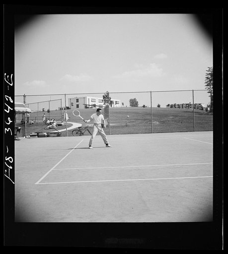 Greenbelt, Maryland. Tennis courts with the school in the background