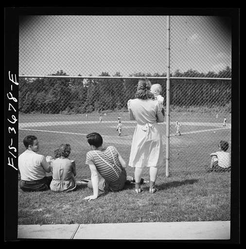 Greenbelt, Maryland. Spectators at a Sunday baseball game