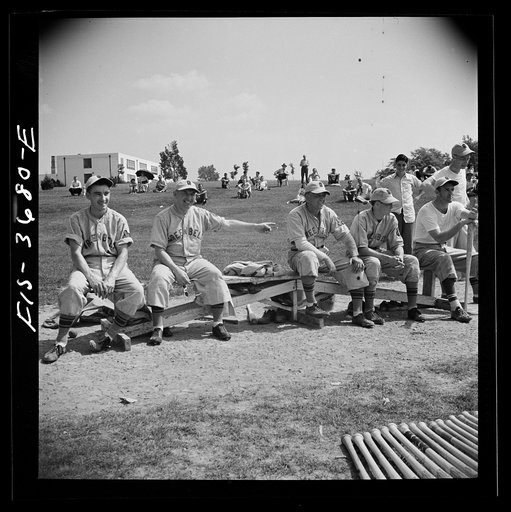 Untitled photo, possibly related to: Greenbelt, Maryland. Member of the Greenbelt baseball team picking out a bat. On Sunday the team plays that of a neighboring town