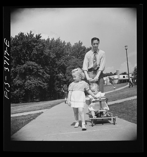 Untitled photo, possibly related to: Greenbelt, Maryland. Family strolling on Sunday