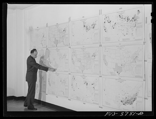 Dr. W. D. Ramage, chief industrial analyst, with agricultural charts developed by his division showing areas of relative production of various vegetables. Regional agricultural research division, Albany, Calif
